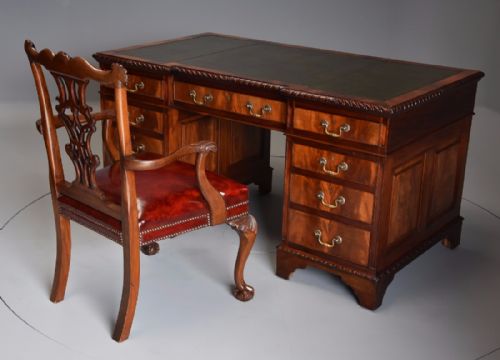 fig 3. Early 20th century mahogany pedestal desk with inverted breakfront green leather top