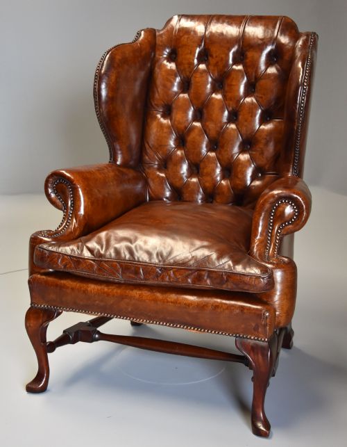 Early 20th Century Georgian Style Deep Buttoned Brown Leather Wing Armchair