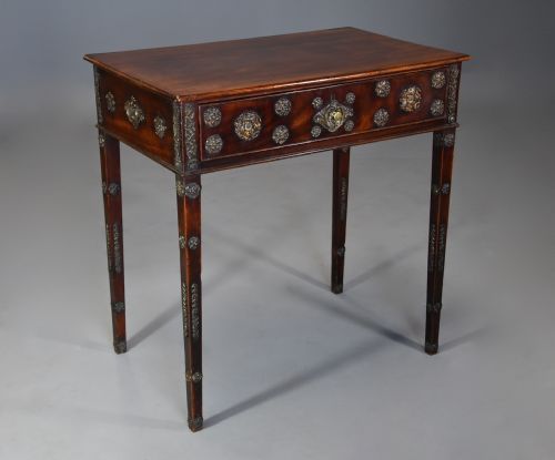 fig 1. Highly decorative late 18th century mahogany side table with later applied brass paterae