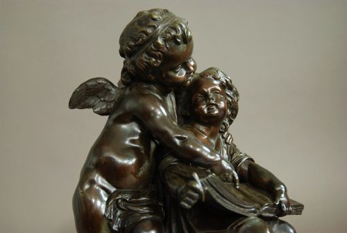 fig 1. Mid 19thc French bronze of a putto next to a seated young girl, marked 'Moreau 1857'