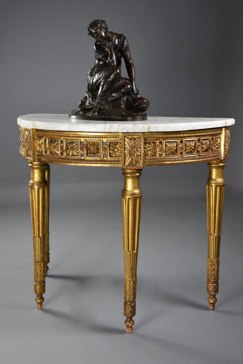 fig 1. Highly decorative late 19th century French demi-lune gilt console table