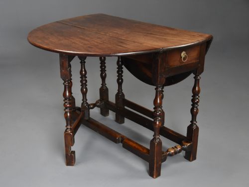 fig 1. Rare late 17th century walnut gateleg table of superb patina
