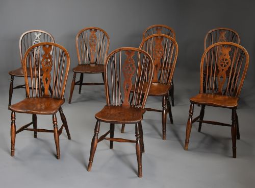 Harlequin Set of Eight Mid 19th Century Ash and Elm Wheelback Windsor Chairs of Superb Patina