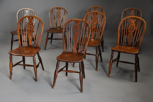 fig 2. Harlequin set of eight mid 19th century ash and elm wheelback Windsor chairs of superb patina