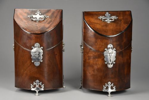 fig 3. A pair of late eighteenth-century bow-front mahogany cutlery boxes with silver mounts and claw feet.