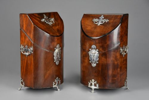 fig 6. A pair of late eighteenth-century bow-front mahogany cutlery boxes with silver mounts and claw feet.
