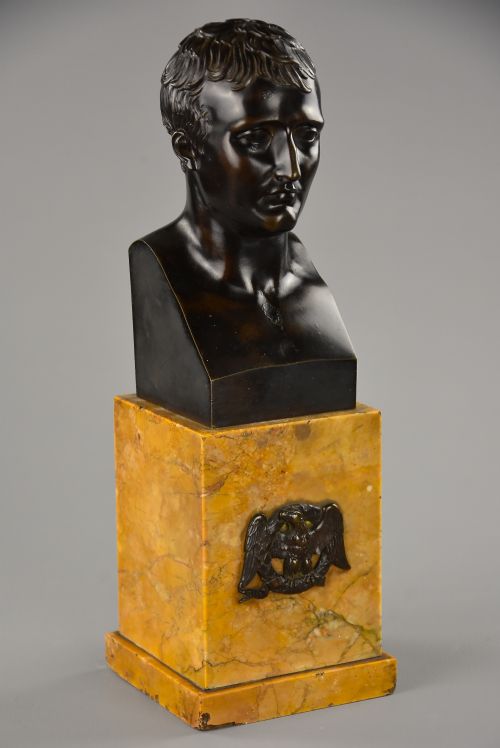 fig 1. A dark patinated bronze bust of Napoleon Bonaparte mounted on a yellow marble plinth decorated with a bronze eagle mount.