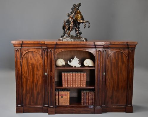MID 19TH CENTURY MAHOGANY BREAKFRONT BOOKCASE WITH GOTHIC INFLUENCE