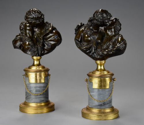 fig 1. A pair of 19th-century patinated bronze miniature busts of kissing figures, mounted on cylindrical grey marble bases with gilt bronze mounts.