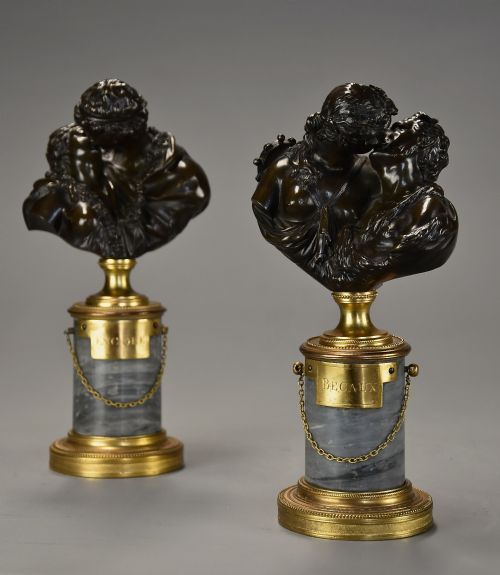fig 4. A pair of 19th-century patinated bronze miniature busts of kissing figures, mounted on cylindrical grey marble bases with gilt bronze mounts.