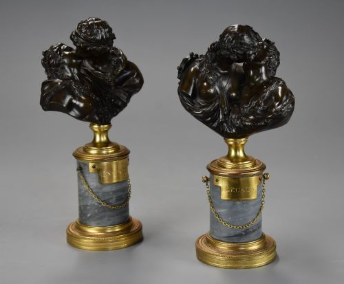 fig 5. A pair of 19th-century patinated bronze miniature busts of kissing figures, mounted on cylindrical grey marble bases with gilt bronze mounts.