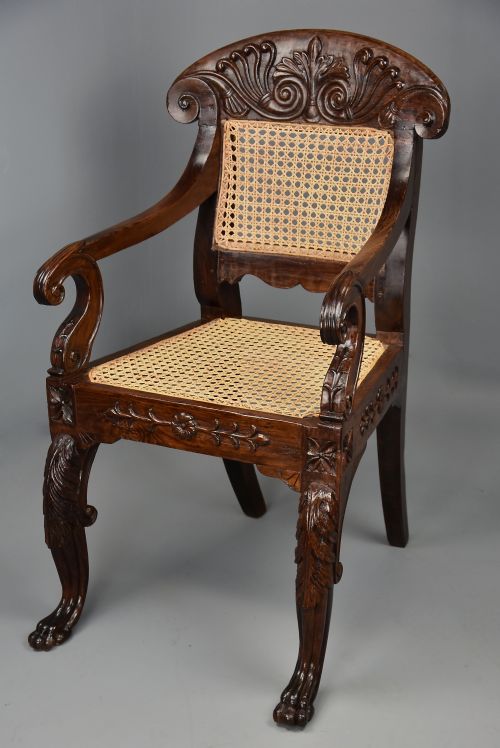 MID 19TH CENTURY ANGLO INDIAN CARVED PADOUK OPEN ARMCHAIR WITH ENGLISH REGENCY INFLUENCES