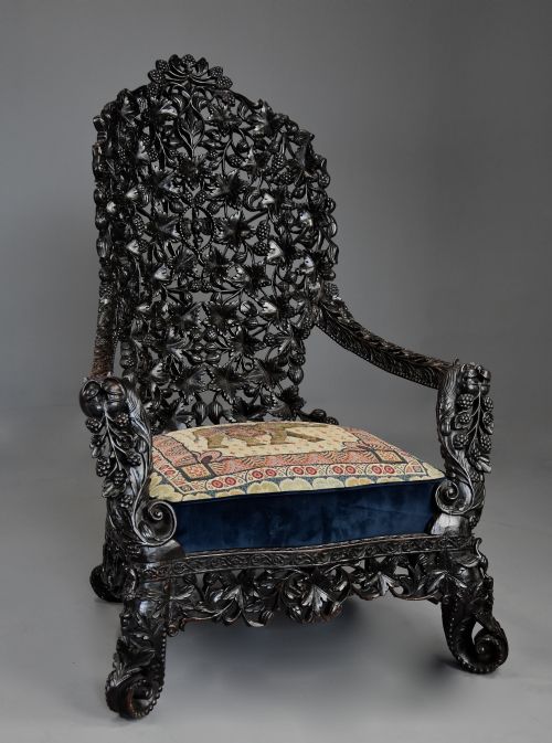 Rare & Highly Decorative Mid 19th Century Indian Carved Blackwood Armchair of Superb Quality