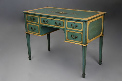 fig 7. An early twentieth-century hand-painted green and gold bedroom suite featuring a wardrobe, chest of drawers with mirror, dressing desk, side tables, and caned chairs decorated with floral urn motifs.