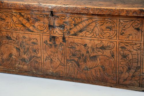 fig 4. Early seventeenth-century Northern Italian cypress wood coffer decorated with detailed incised panels depicting mythical beasts and heraldic symbols.