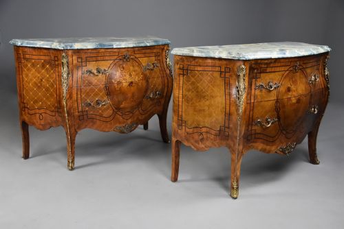 fig 4. A pair of early twentieth-century French Kingwood bombe commodes featuring floral marquetry panels, serpentine blue marble tops, and detailed gilt-bronze mounts.
