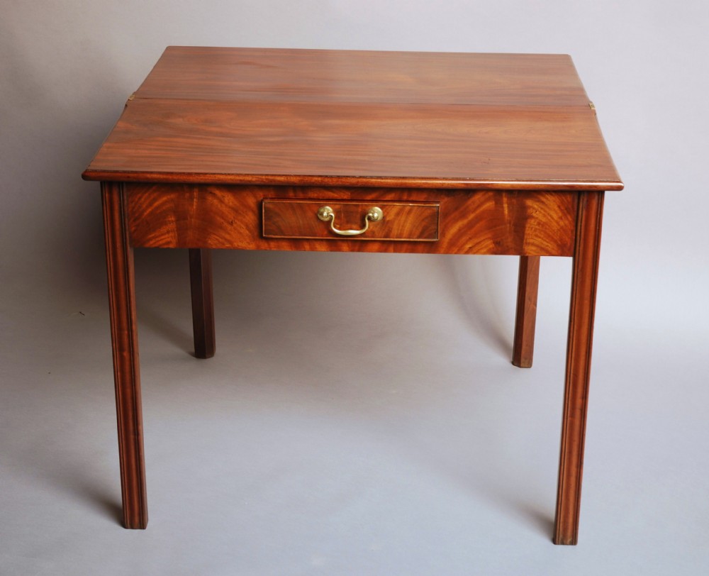 Mid 18thc mahogany tea table of good patina.