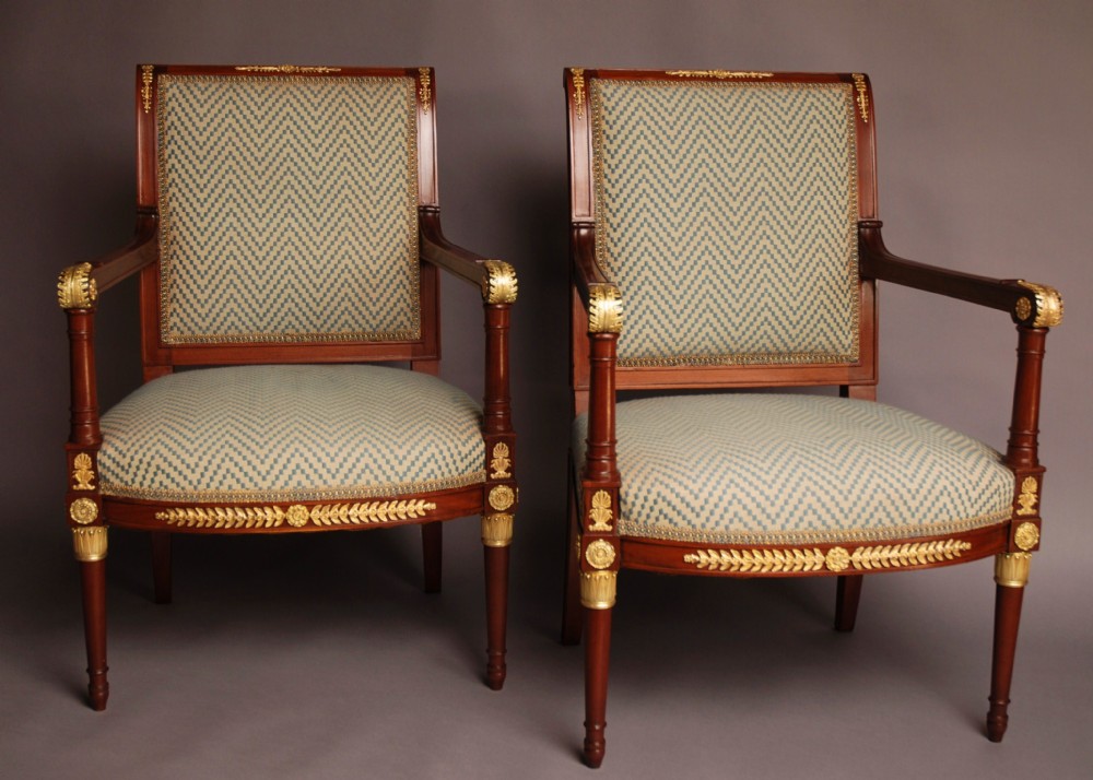 Pair of highly decorative French early 20thc mahogany & gilt metal armchairs 