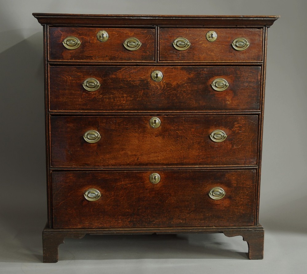 An early 18th century oak chest of drawers of superb patina