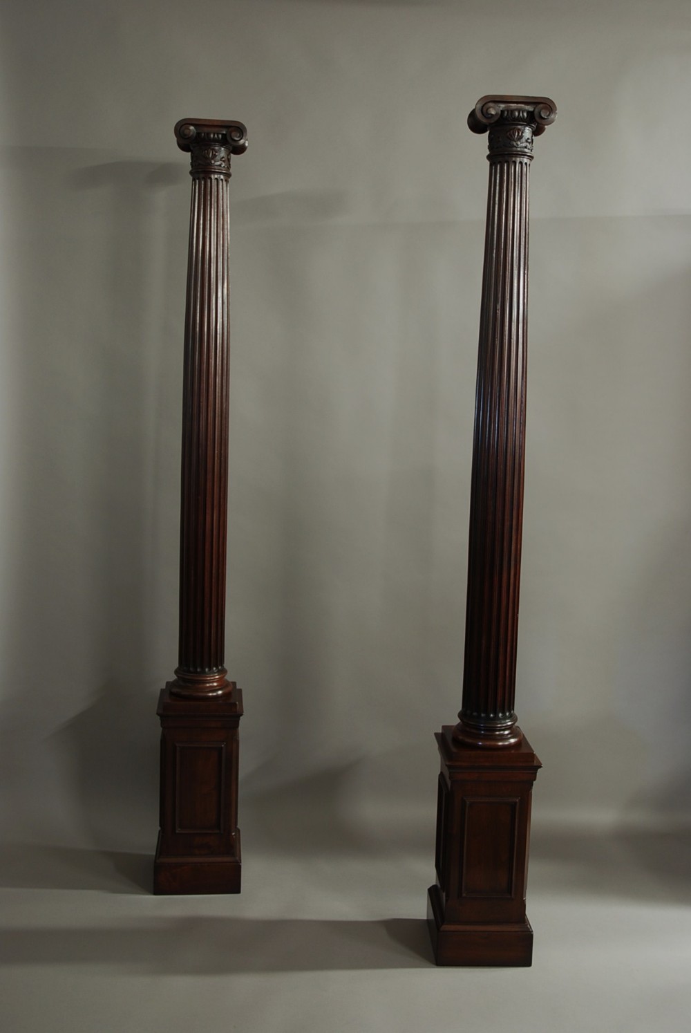 Pair of decorative walnut Ionic columns