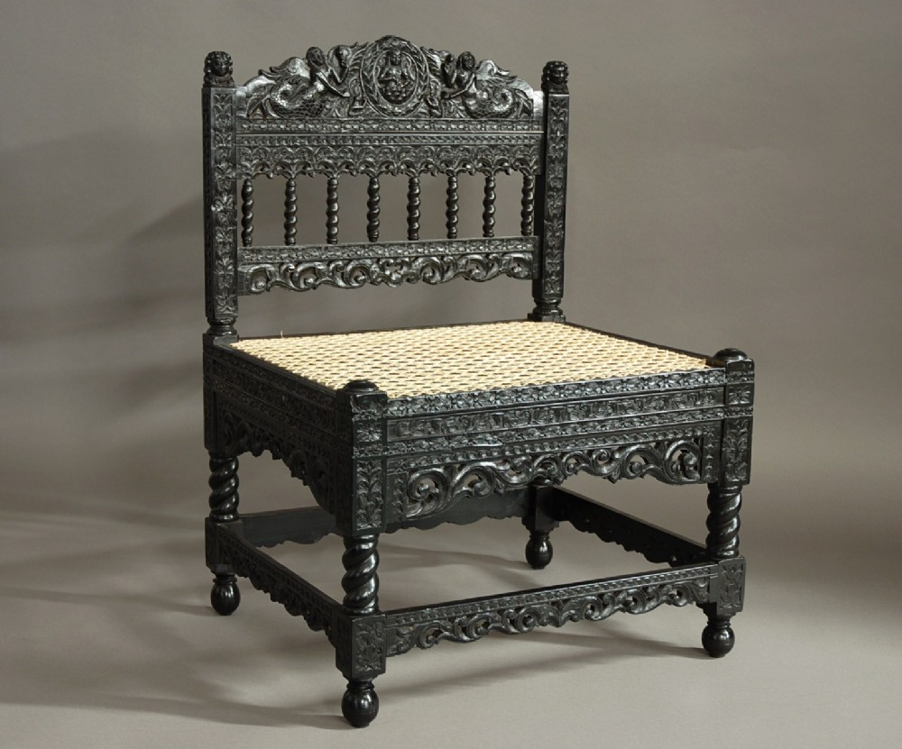 Superb quality late 17th century solid ebony low chair