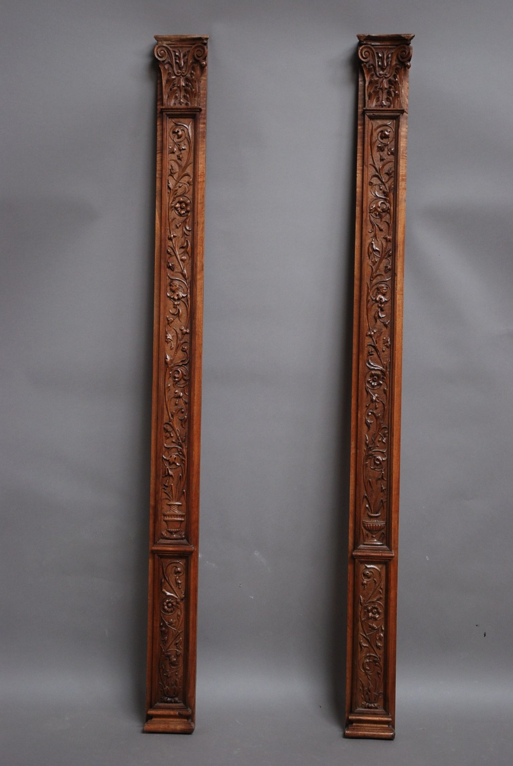 Pair of late 19thc Continental carved walnut pilasters
