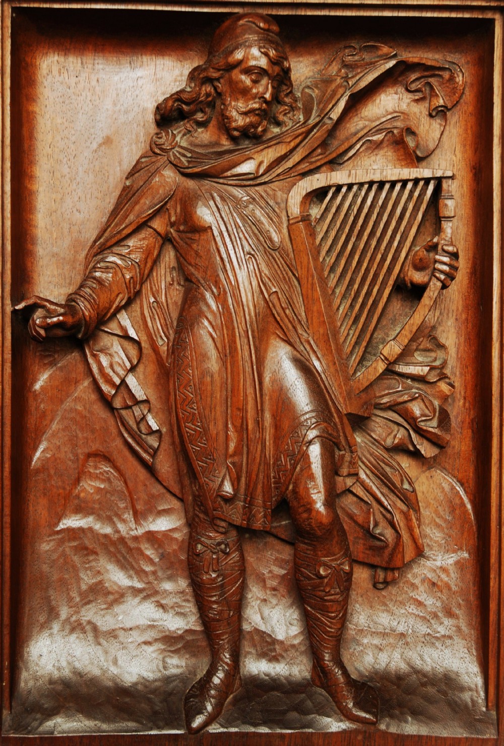 Continental 19thc walnut finely carved relief carving of a Medieval man