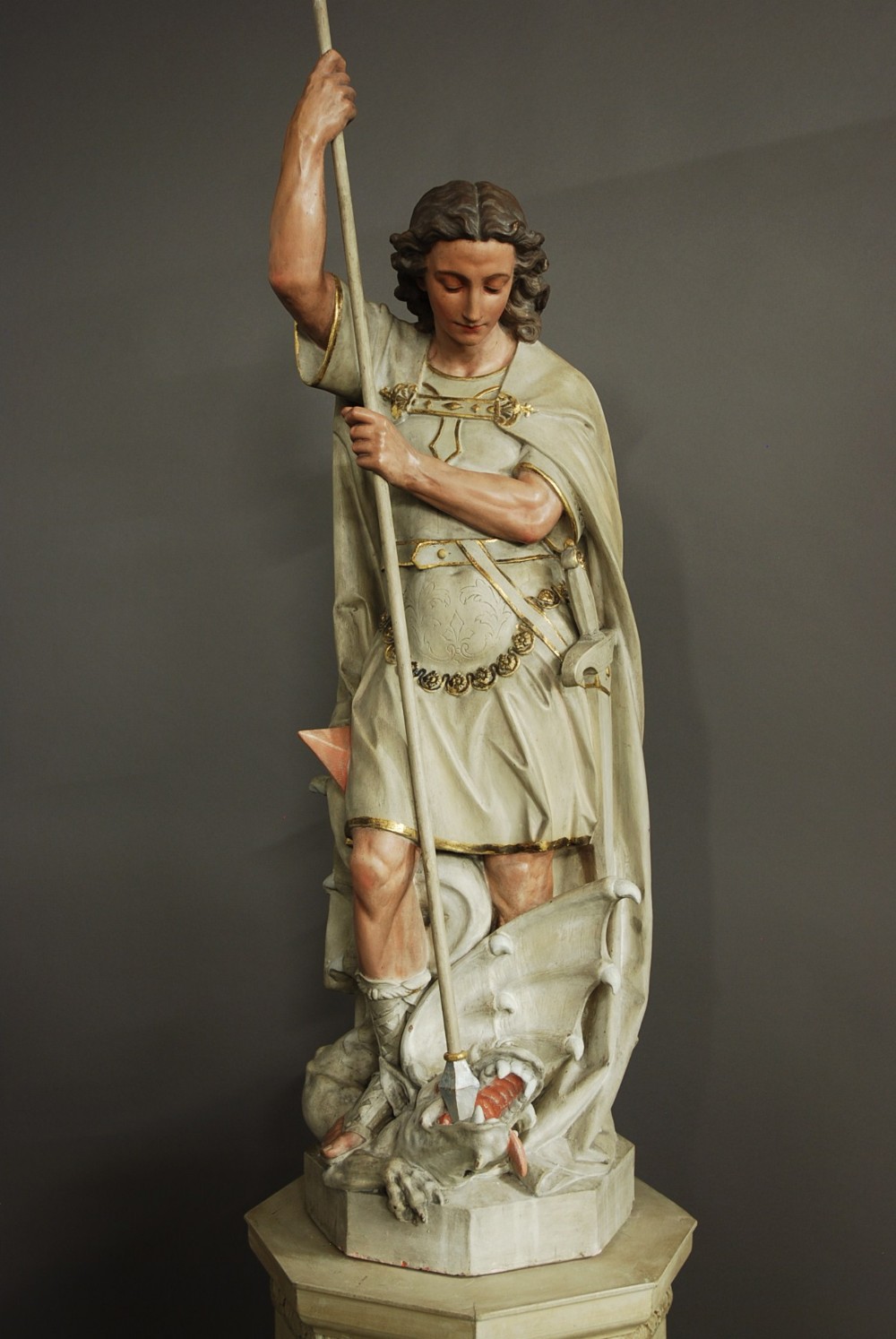 Highly decorative large Continental polychrome terracotta figure of St Michael & the Dragon