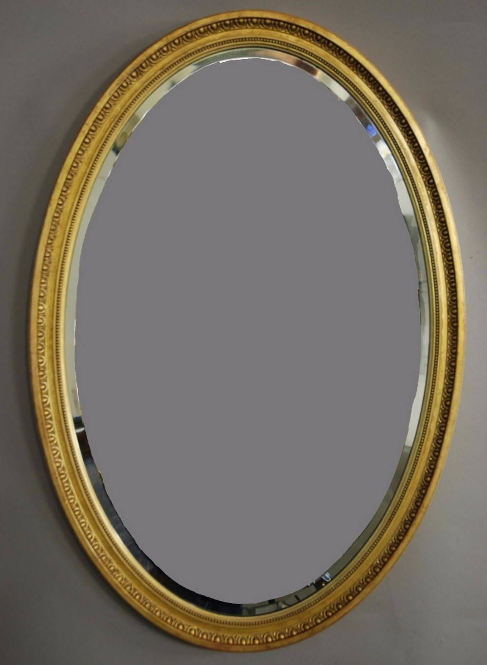 Early 20th century oval giltwood mirror