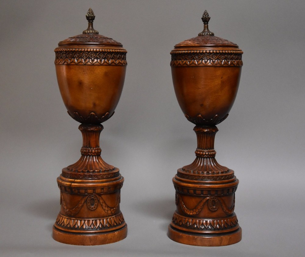 Finely carved pair of early 20th century decorative wooden urns