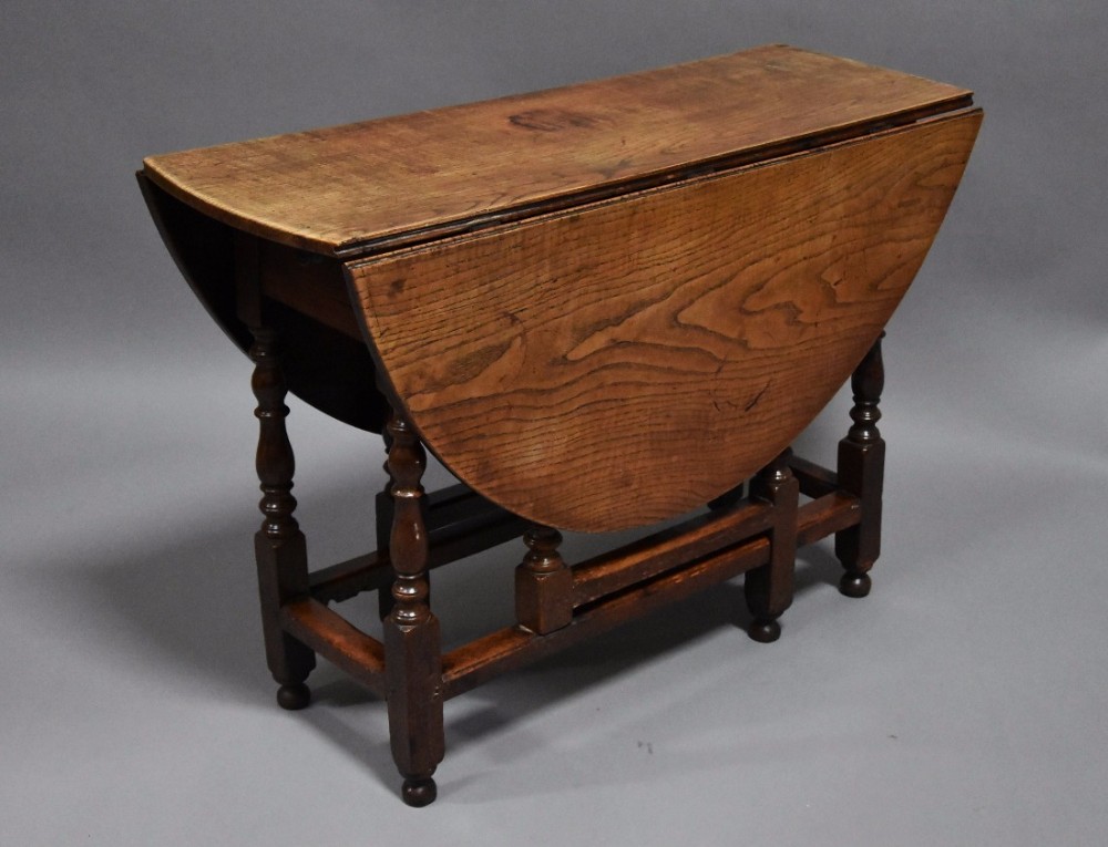 Early 18th century oak and ash oval gateleg table