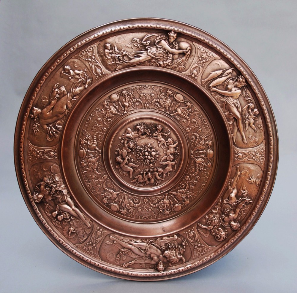 Large highly decorative 19thc cast copper charger depicting signs of the Zodiac