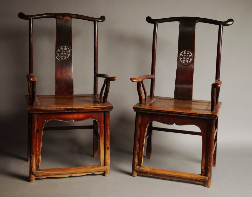 Pair of late 19th century Chinese yoke back elm armchairs of good patina