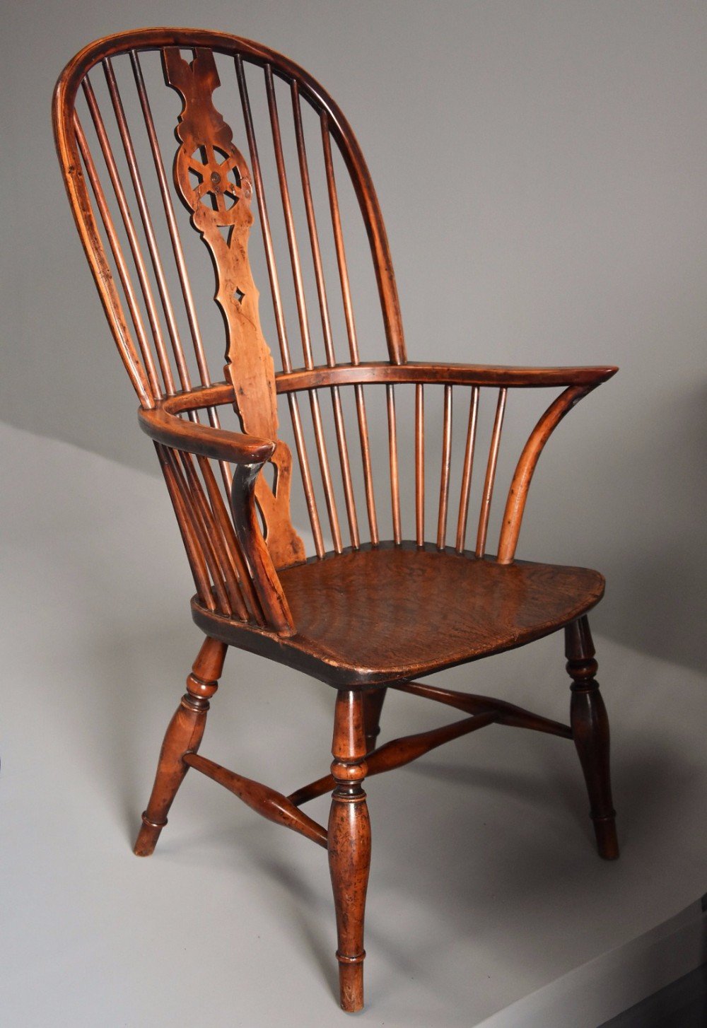 19thc fruitwood & elm high back hoop Windsor armchair of superb patina