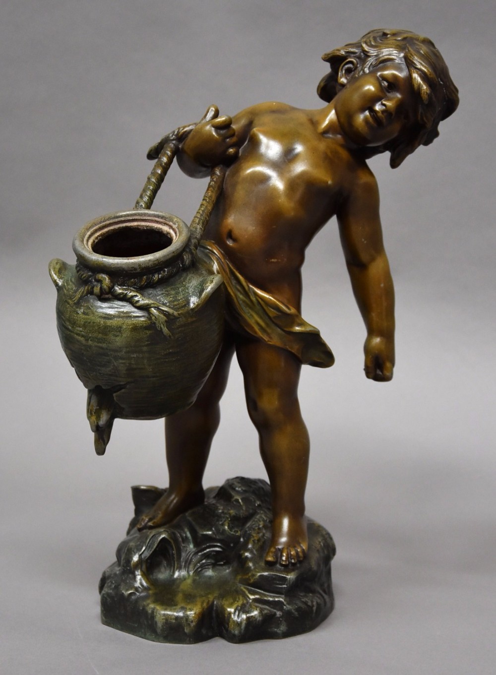 19thc French patinated bronzed spelter figure of young male water carrier signed Auguste Moreau