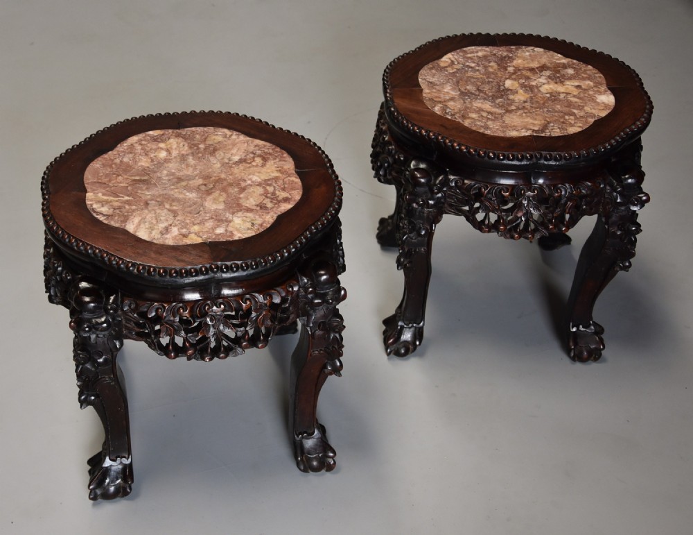 Pair of late 19th century Chinese hardwood circular pot stands or low tables
