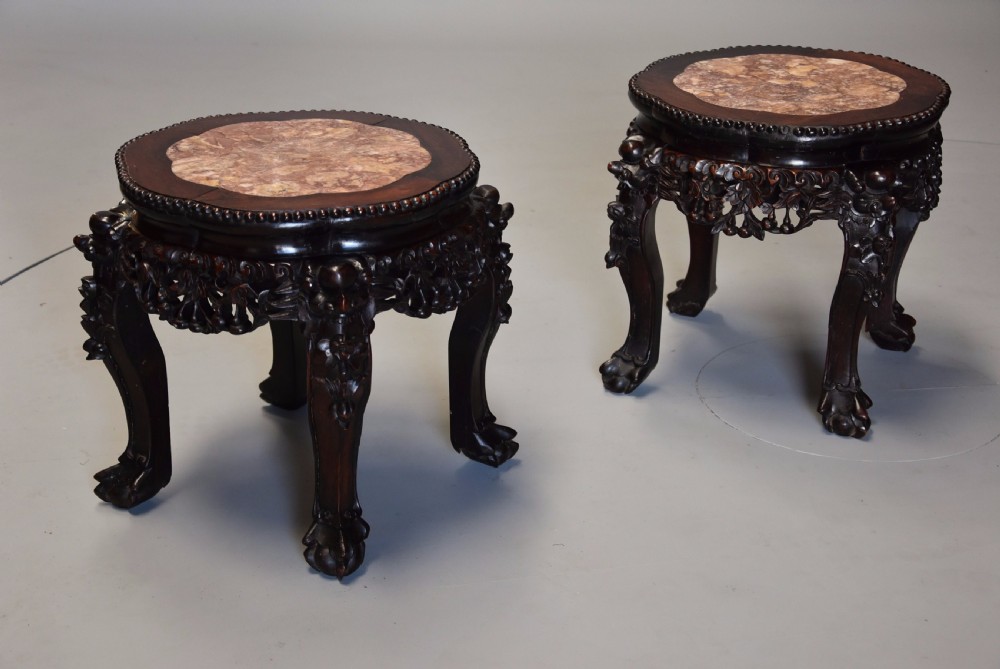Pair of late 19th century Chinese hardwood circular pot stands or low tables View III