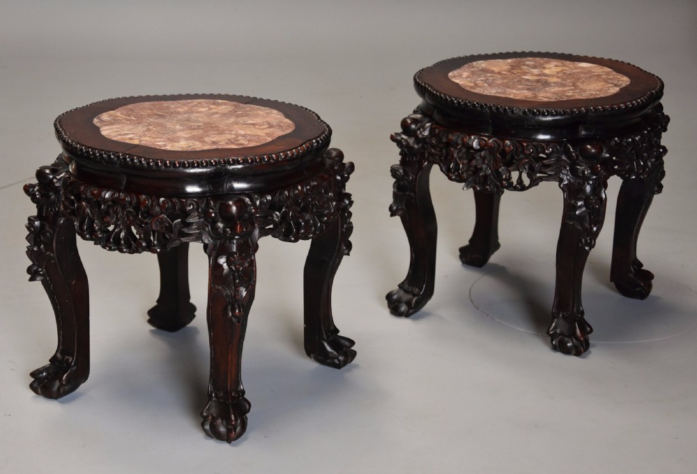 Pair of late 19th century Chinese hardwood circular pot stands or low tables View V