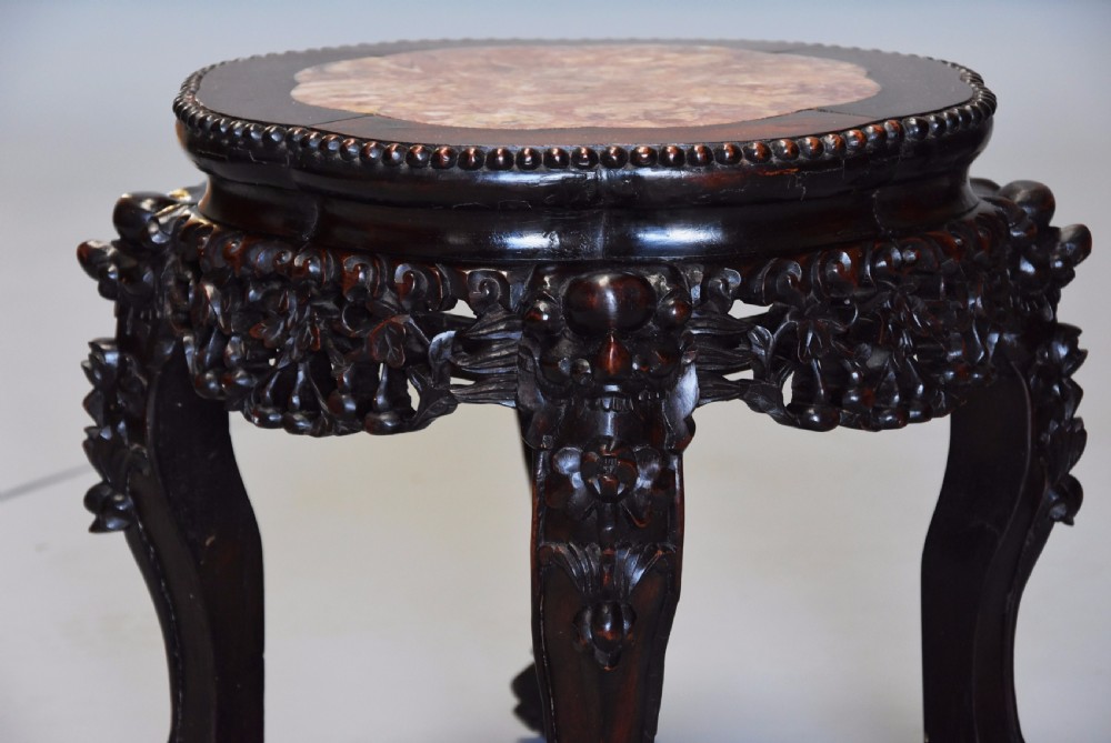 Pair of late 19th century Chinese hardwood circular pot stands or low tables View VI