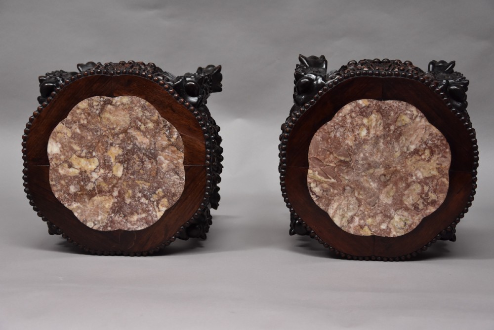 Pair of late 19th century Chinese hardwood circular pot stands or low tables View VIII
