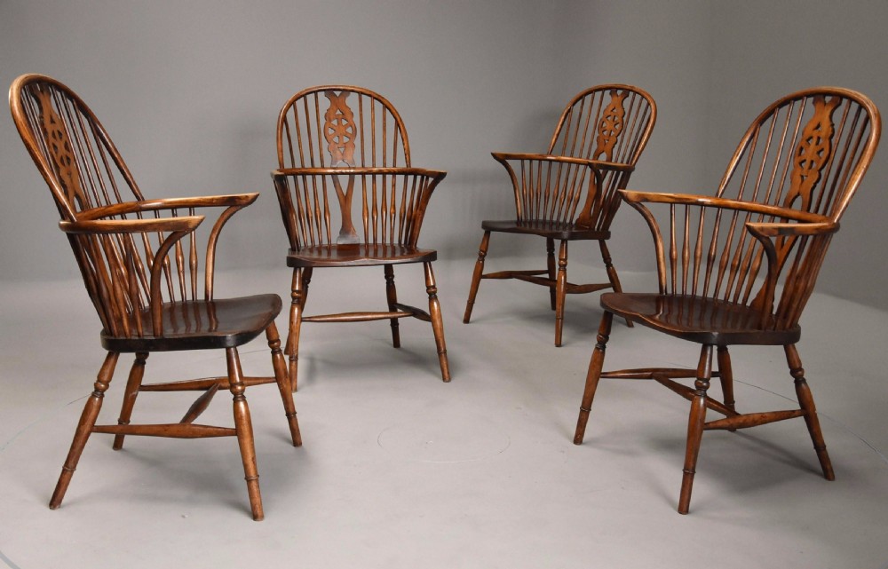 Set of four early 20th century ash and elm wheelback Windsor armchairs