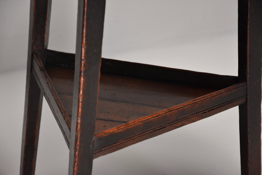Late 18th century oak cricket table with shelf and of fine patina  View XIII