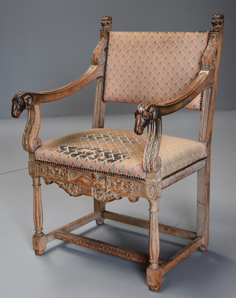 Late 19thc highly decorative French limed oak armchair in the Renaissance style