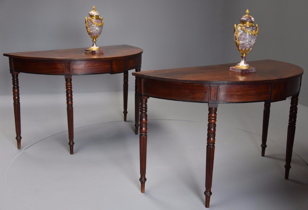 Pair of good quality early 19thc mahogany demi-lune console tables with superb patina