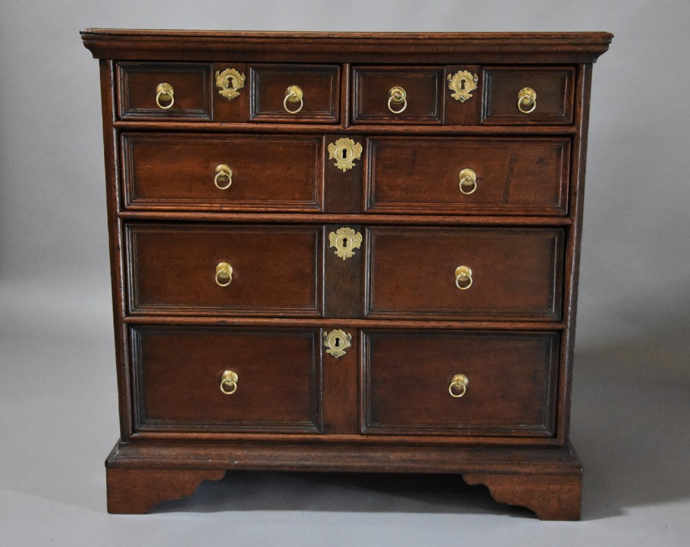 Early 18th century oak and elm moulded front chest of drawers of good patina View III