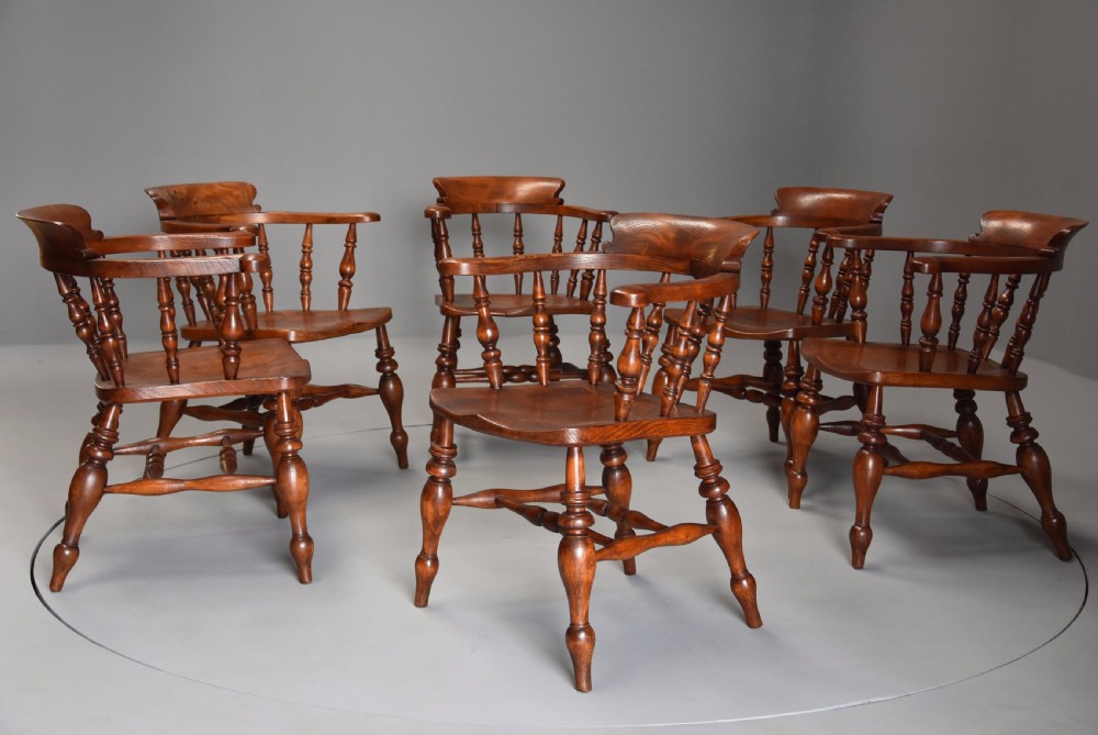 Superb set of six mid 19th century nicely figured elm Smokers bow Windsor chairs View II