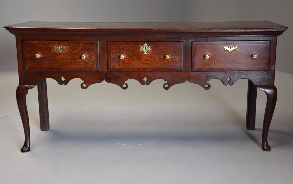Mid 18th century oak cabriole leg dresser base of rich patina View II