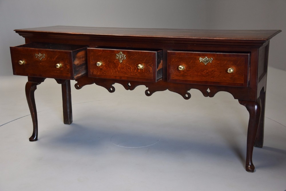 Mid 18th century oak cabriole leg dresser base of rich patina View III