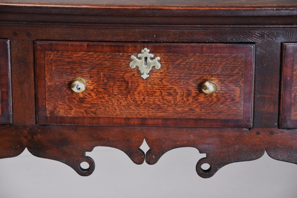 Mid 18th century oak cabriole leg dresser base of rich patina View VI