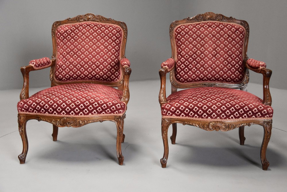 Pair of late 19thc French walnut fauteuils in the Louis XV style with traces of original gilt View II